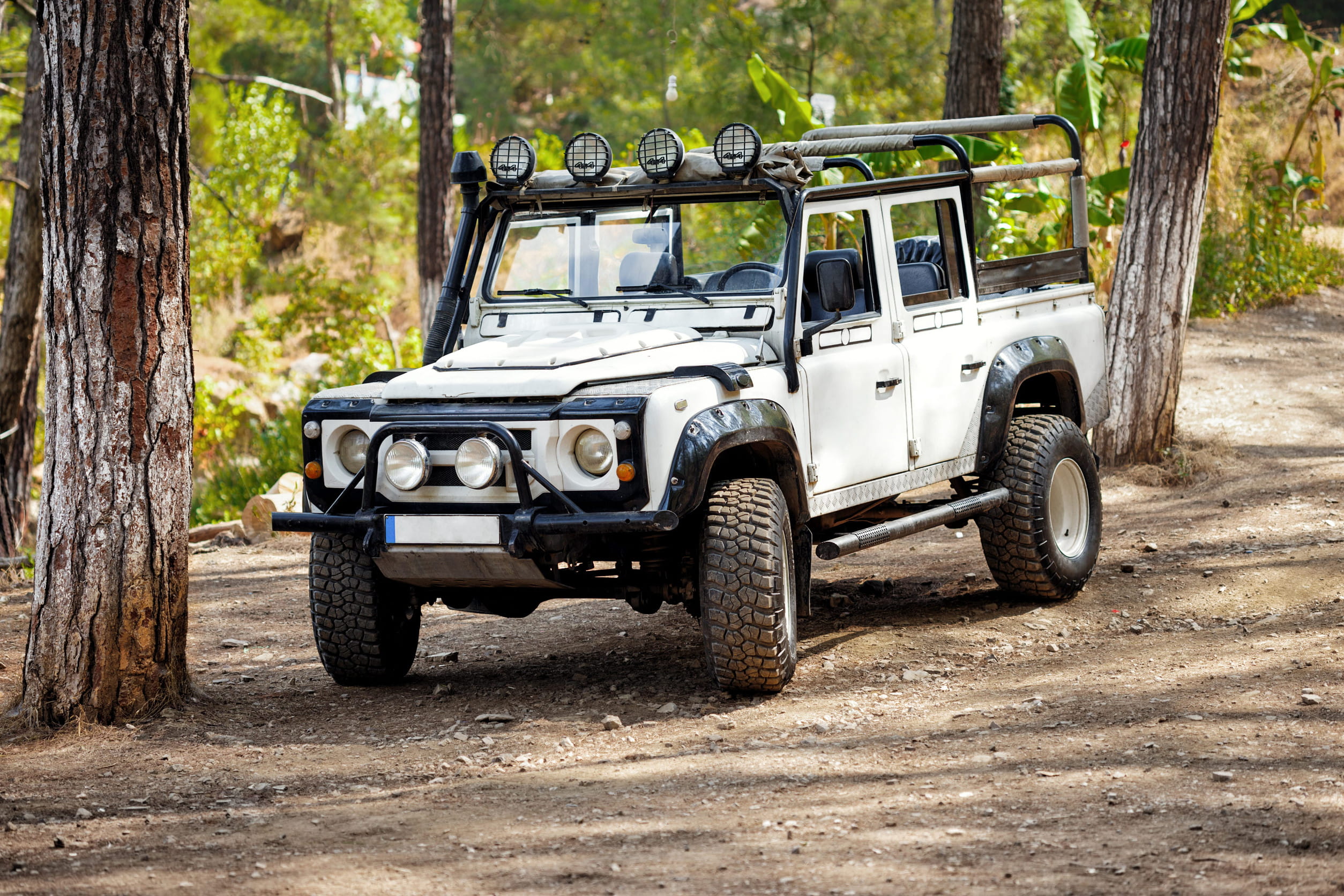4x4 Vehicle Traveling On Rough Forest Access Road Near The Park