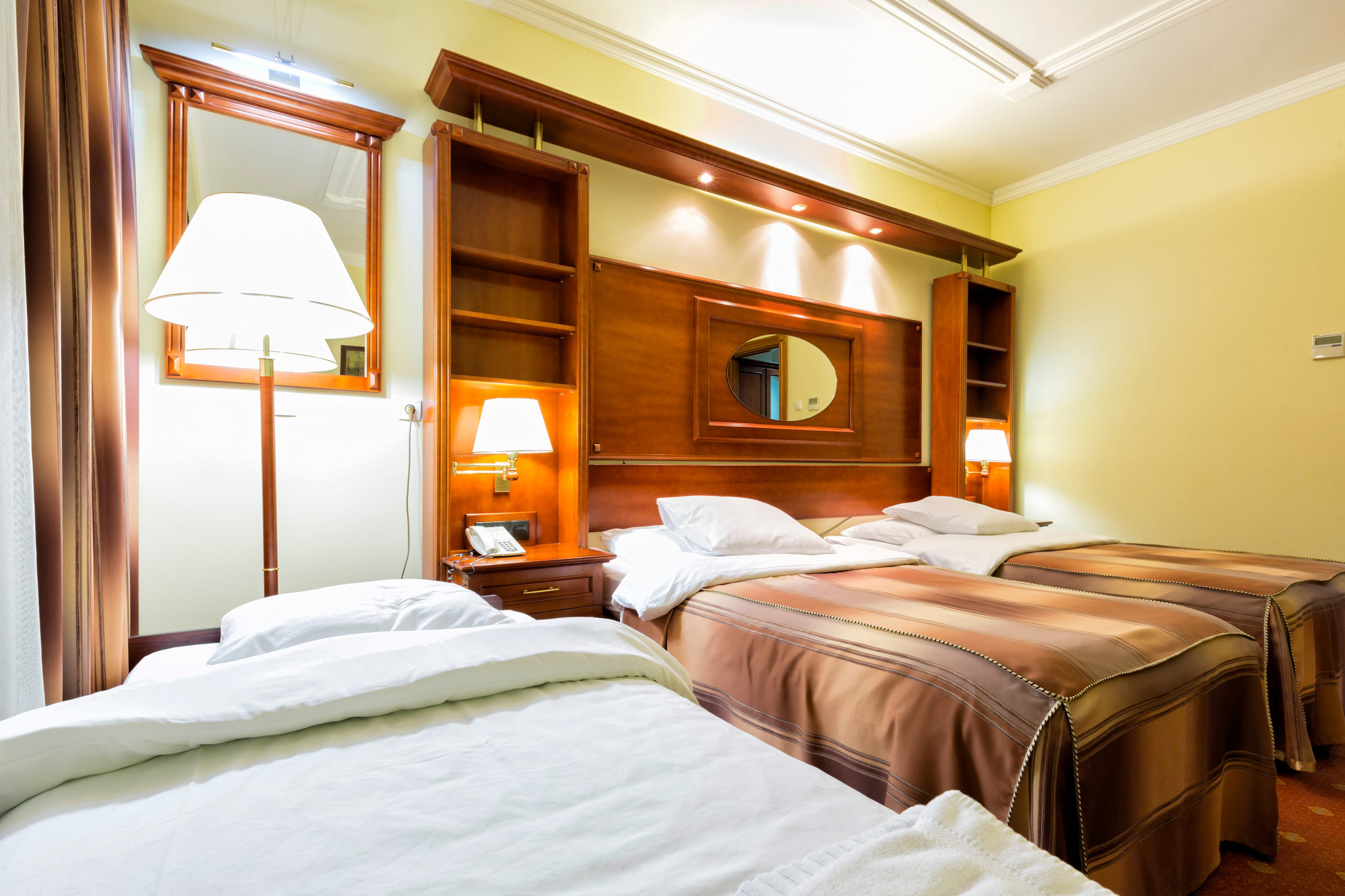 A twin bedroom with aesthetic lightings