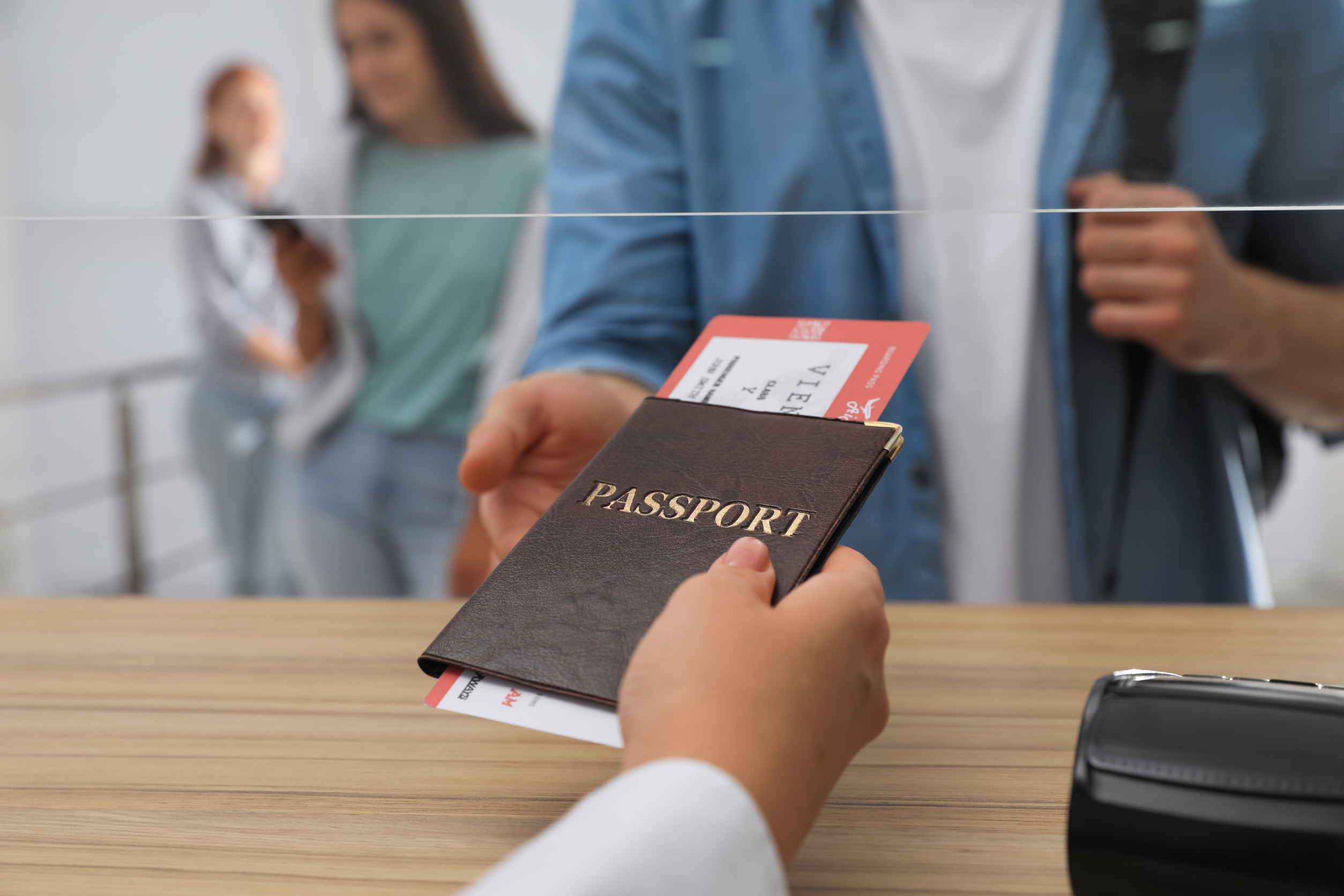 Agent Giving Passport To Client