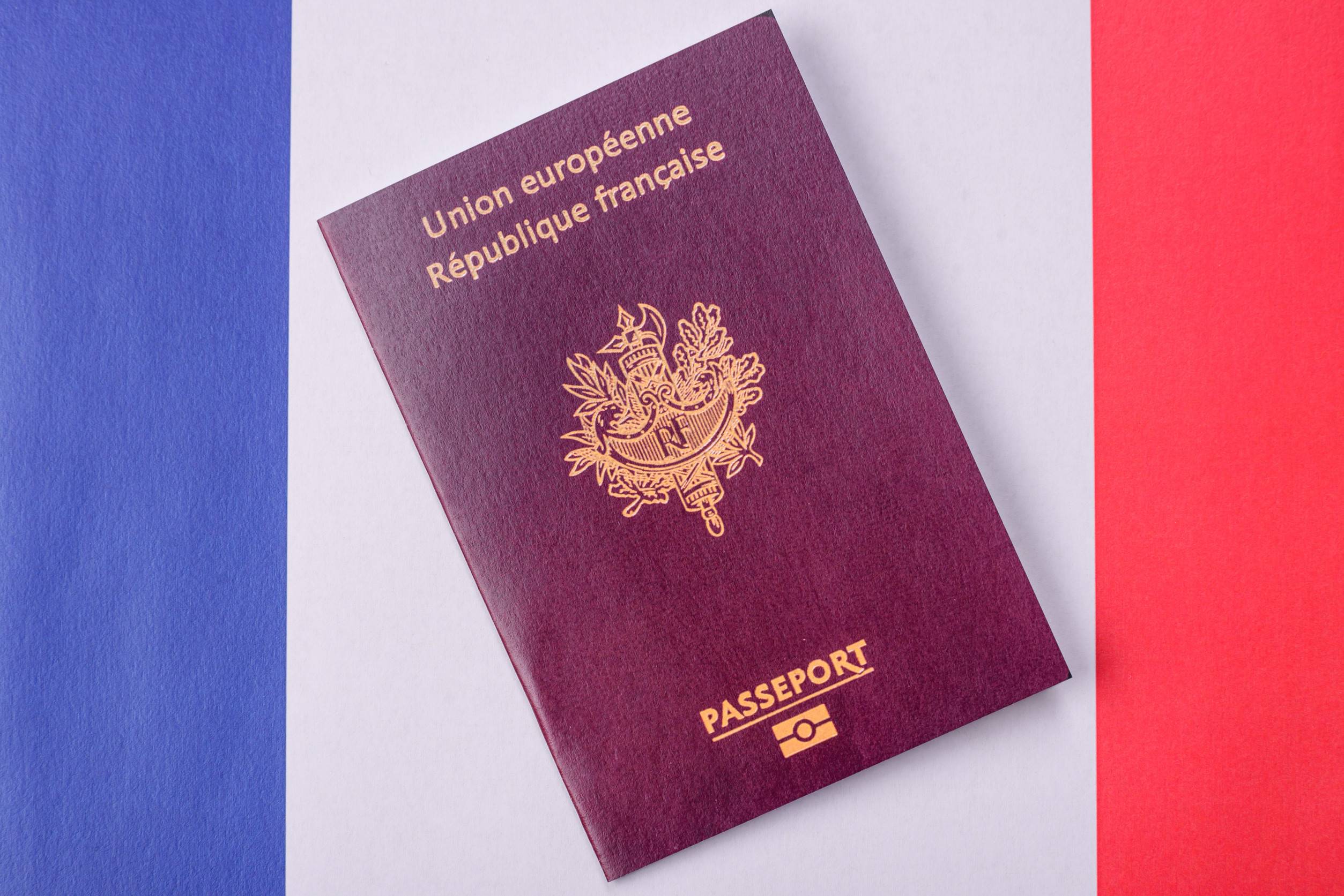 French Passport On National Flag