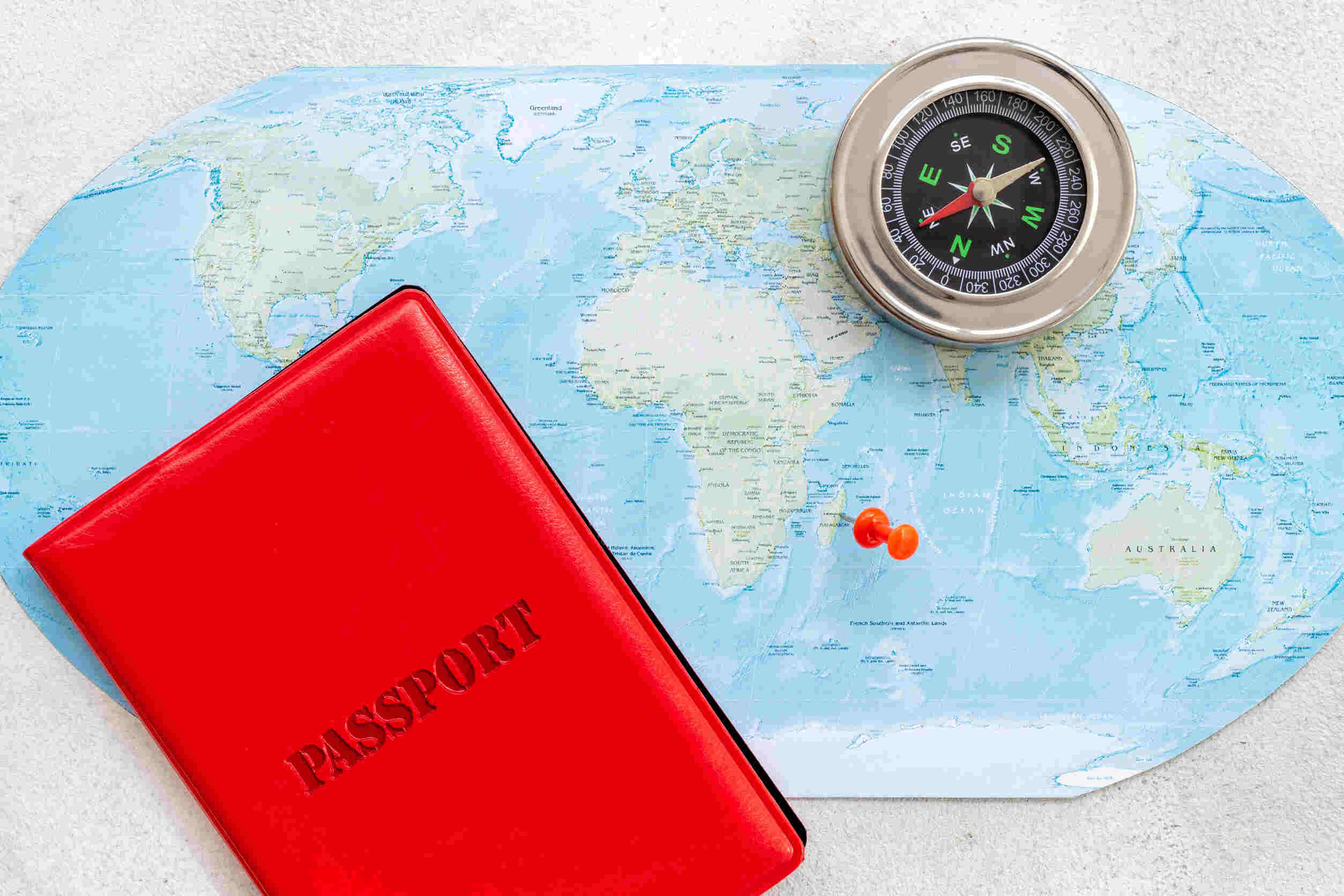 Passport With Compass On World Map