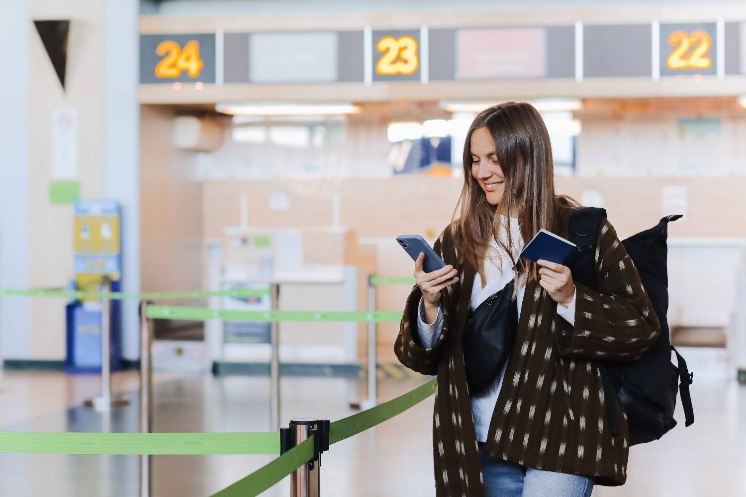 woman tourist showing passport at airport