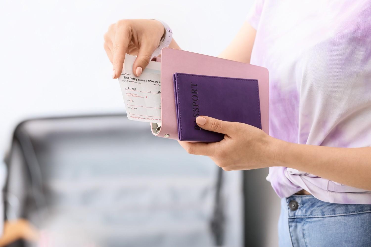 Woman With Travel Organizer And Passport